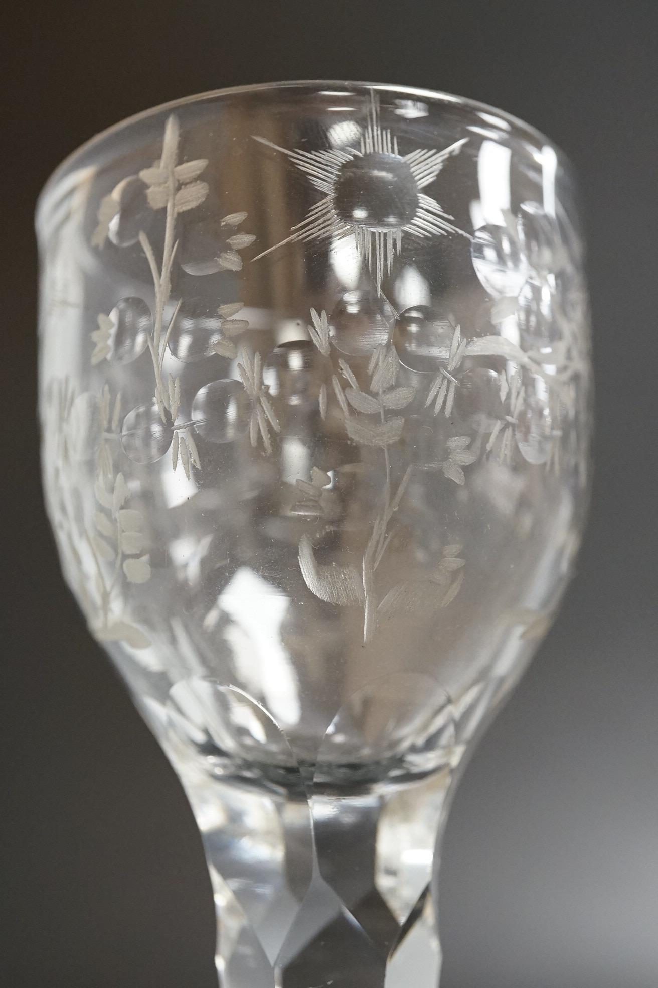 An opaque twist firing glass with terraced foot and a faceted wine glass with domed foot, c.1760, tallest 14cm